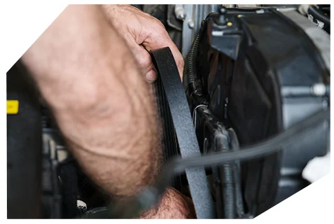 Belts & Hoses01 A hand inspecting or adjusting a vehicle's serpentine belt within the engine compartment during routine maintenance or troubleshooting work.